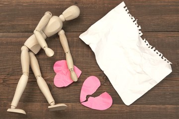 Wood Humane Figurine, Torn Paper Page And Broken Hearts