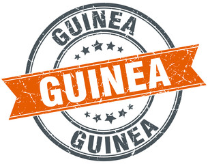Guinea red round grunge vintage ribbon stamp