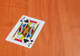 Plastic poker cards on wooden background