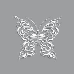 White paper butterfly with vintage pattern on gray background