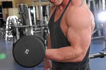 Man Curling Dumbbell