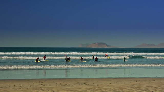 Surfers in Famara beach, Lanzarote