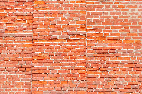 Ancient cut away brick wall with outdent background

