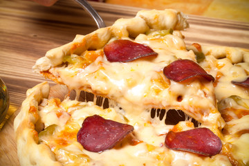 Prepared pizza with smelted cheese. Selective focus. Toned