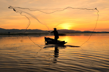 Silhouette Fisherman boat Thailand.