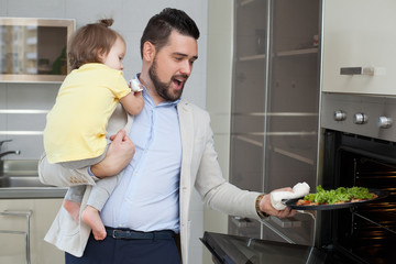 Father and child preparing pizza together