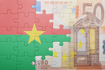 puzzle with the national flag of burkina faso and euro banknote