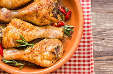 Roasted chicken legs with rosemary, garlic and red chili pepper