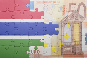 puzzle with the national flag of gambia and euro banknote