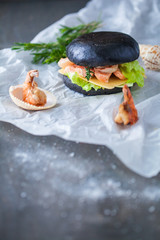 Home made burgers on wooden table