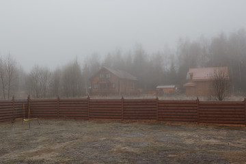 child wing on frozen lawn in mist