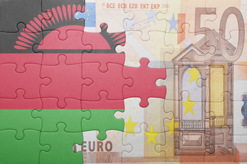 puzzle with the national flag of malawi and euro banknote