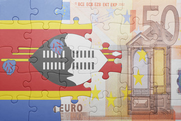 puzzle with the national flag of swaziland and euro banknote