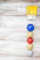 christmas balls isolated on a wooden background