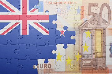 puzzle with the national flag of new zealand and euro banknote