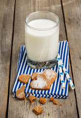 Glass of milk on a rustic wooden table