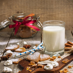 Glass of milk on a rustic wooden table
