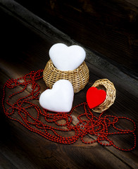 Hearts, Small Wooden Basket And String Of Red Beads On Old Wooden Boards. Love Composition.