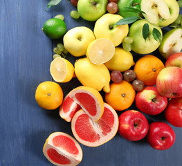 Fruits on dark blue wooden background