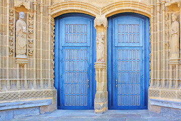 double blue church doors in guernica, basque country, spain