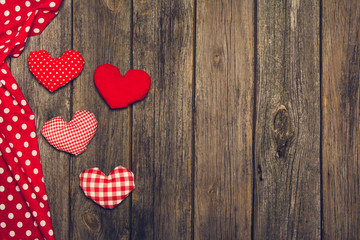 Valentines background. Hearts on an old, wooden table.