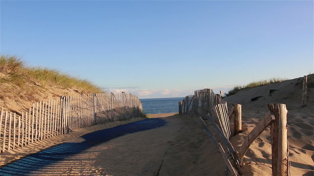 Sand with blue carpet to beach in Cape Cod, Massachusetts