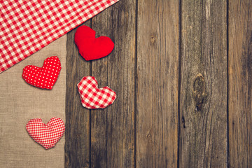 Valentines background. Hearts on an old, wooden table.