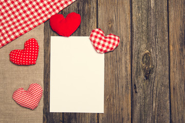 Valentines background. Hearts on a wooden floor or table.