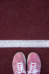 Top view of shoes on running track