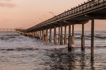 Long view of Ocean Beach fishing pier in San Diego, California.