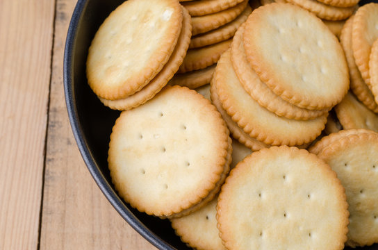Crackers biscuits on wooden background