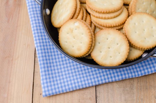 Crackers biscuits on wooden background