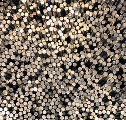 Many shiny metal round bars as background