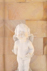 Old Cupid statue.