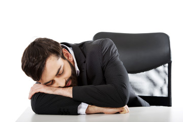 Fototapeta premium Businessman resting at the desk.