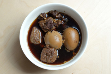 Egg strew in black soup