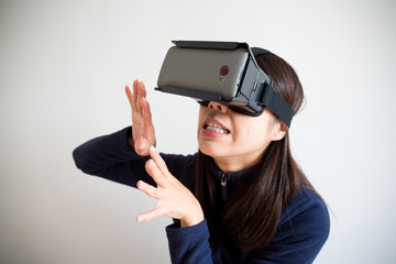 Asian Woman wear with vr device and feeling afraid