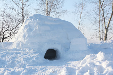 The dwelling an igloo   on a snow glade in the winter at sunset