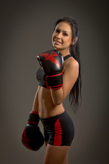 Girl boxer on a dark background