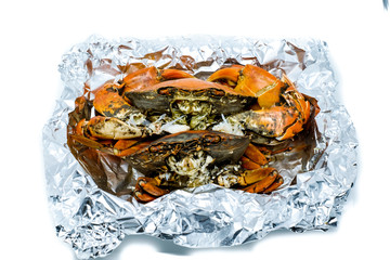 Close up of Steamed Crab warp with Aluminium Foil in the box iso