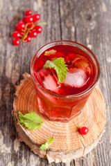 Summer berry cold drink (juice, cocktail, fruit tea) with mint