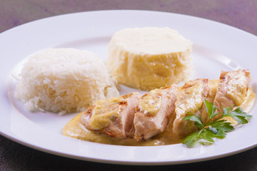 Pork meat with rice and smash potato