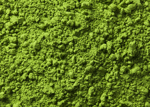 Background of green powder surface close up macro shot