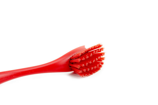 cropped image of plastic red toilet brush on a white background