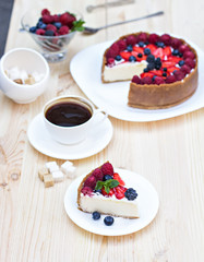 Cheesecake with fresh berries o the table