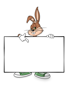 cooler Osterhase zeigt auf weisses Schild