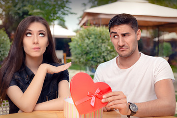 Girl Refusing Heart Shaped Gift From Her Boyfriend