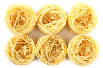 Twisted noodles isolated on white background. Italian food object.