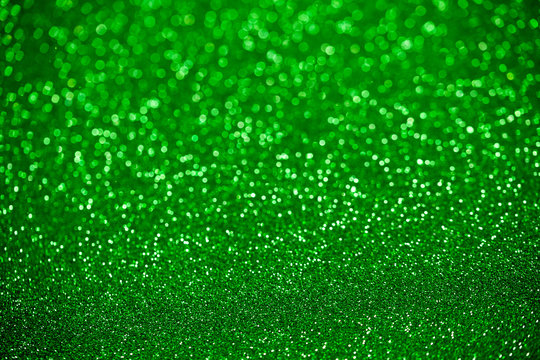 Abstract green bokeh background for Christmas / St Patrick Day holidays