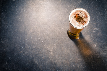 Beer glass on dark table